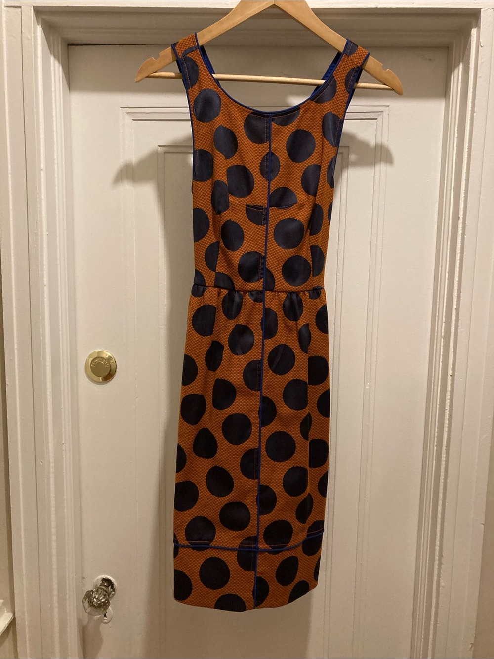 Maeve Navy Polka Dot Sheath Dress on Rust with pockets